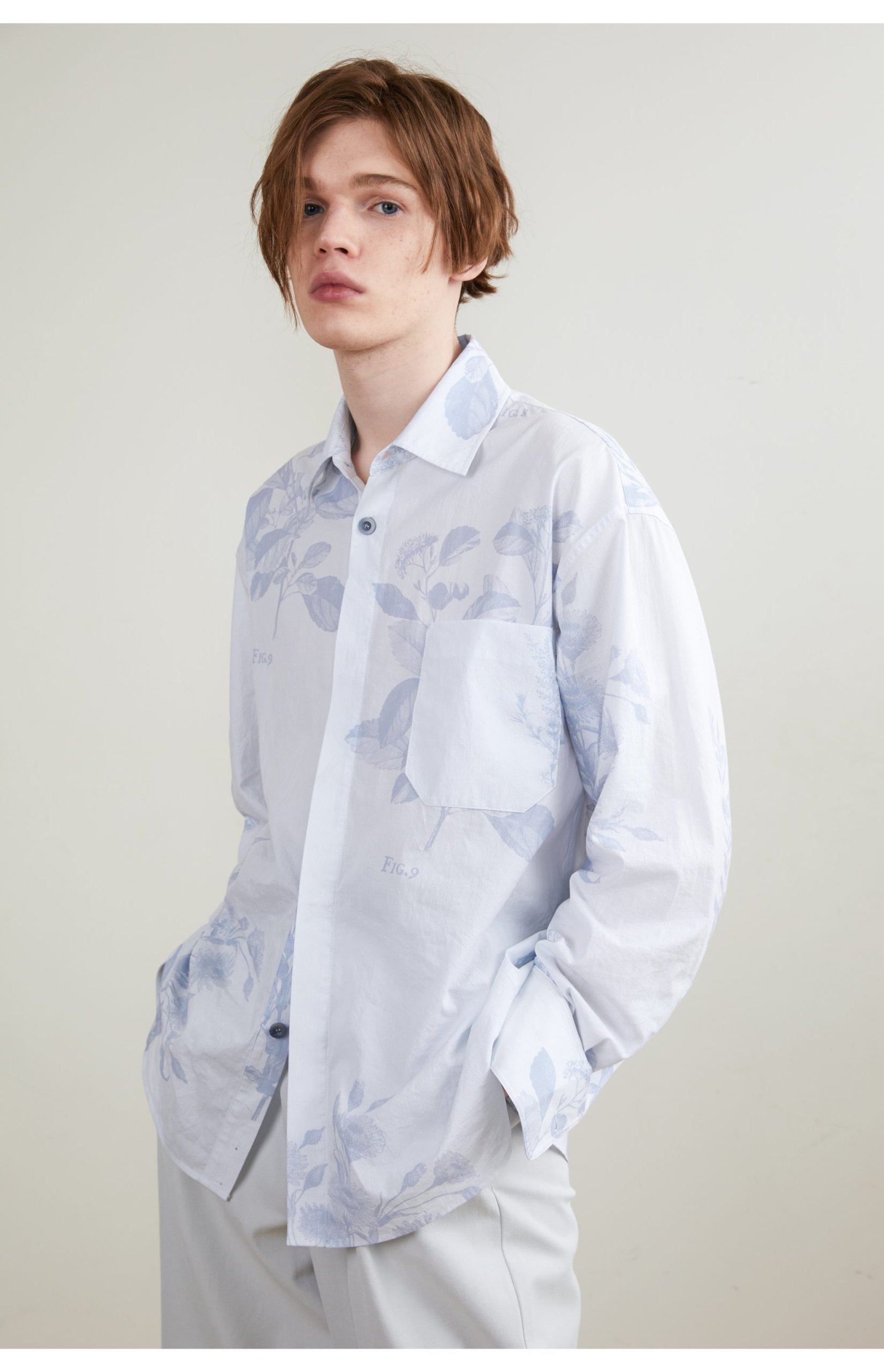 The light blue long sleeve shirt is smooth and draped