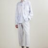 The light blue long sleeve shirt is smooth and draped