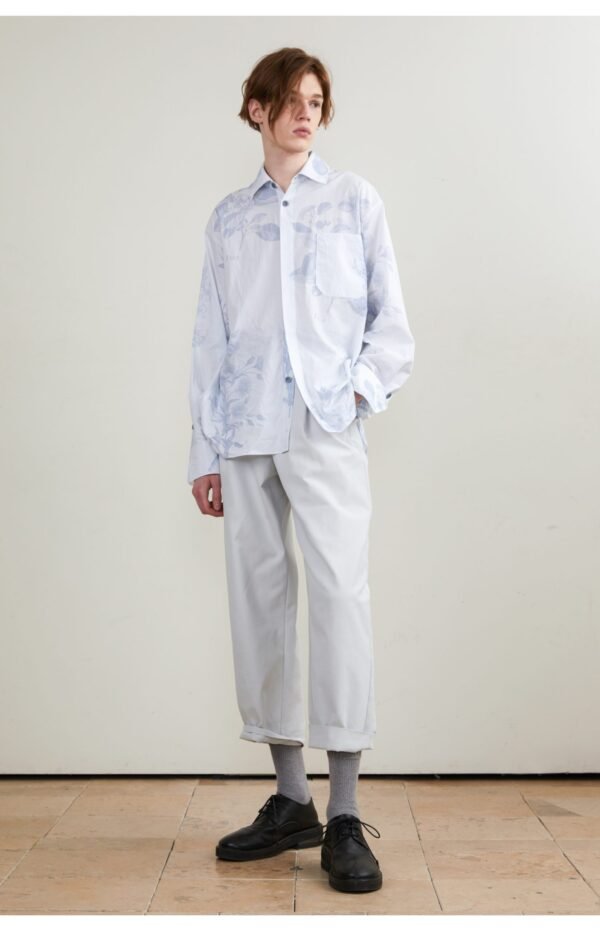 The light blue long sleeve shirt is smooth and draped