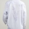 The light blue long sleeve shirt is smooth and draped