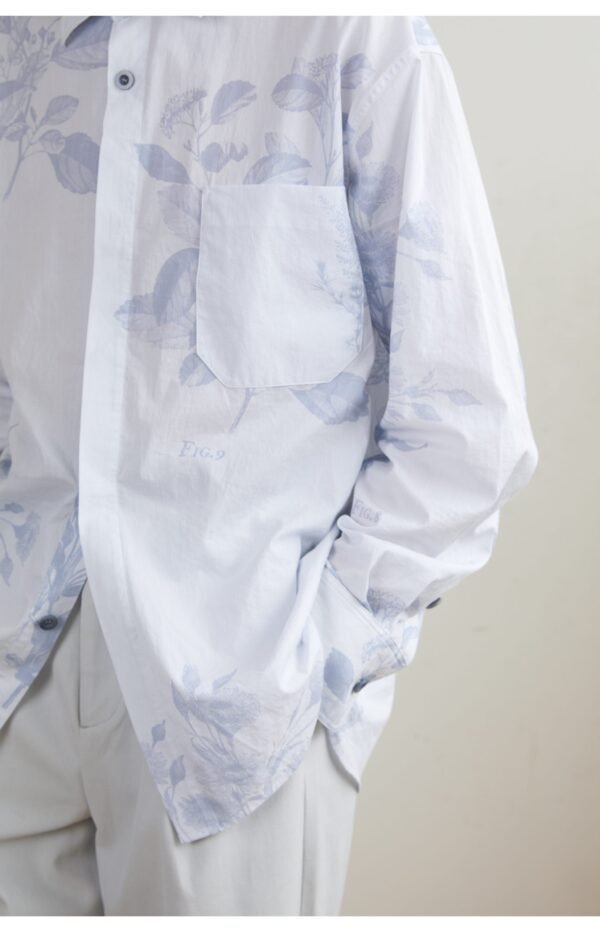 The light blue long sleeve shirt is smooth and draped